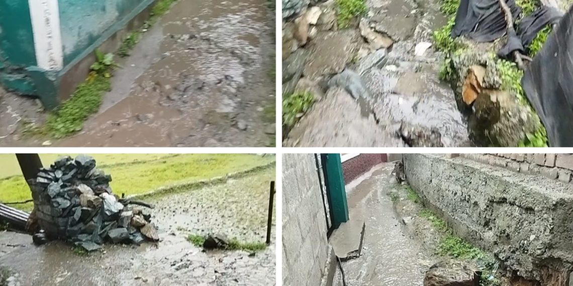 People Suffer as Water Flows on  Footpath Near the SDM Residence in Karnah 