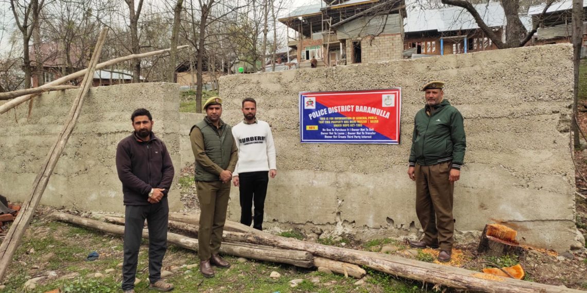 Police attaches illegal acquired property of notorious drug peddler in Baramulla